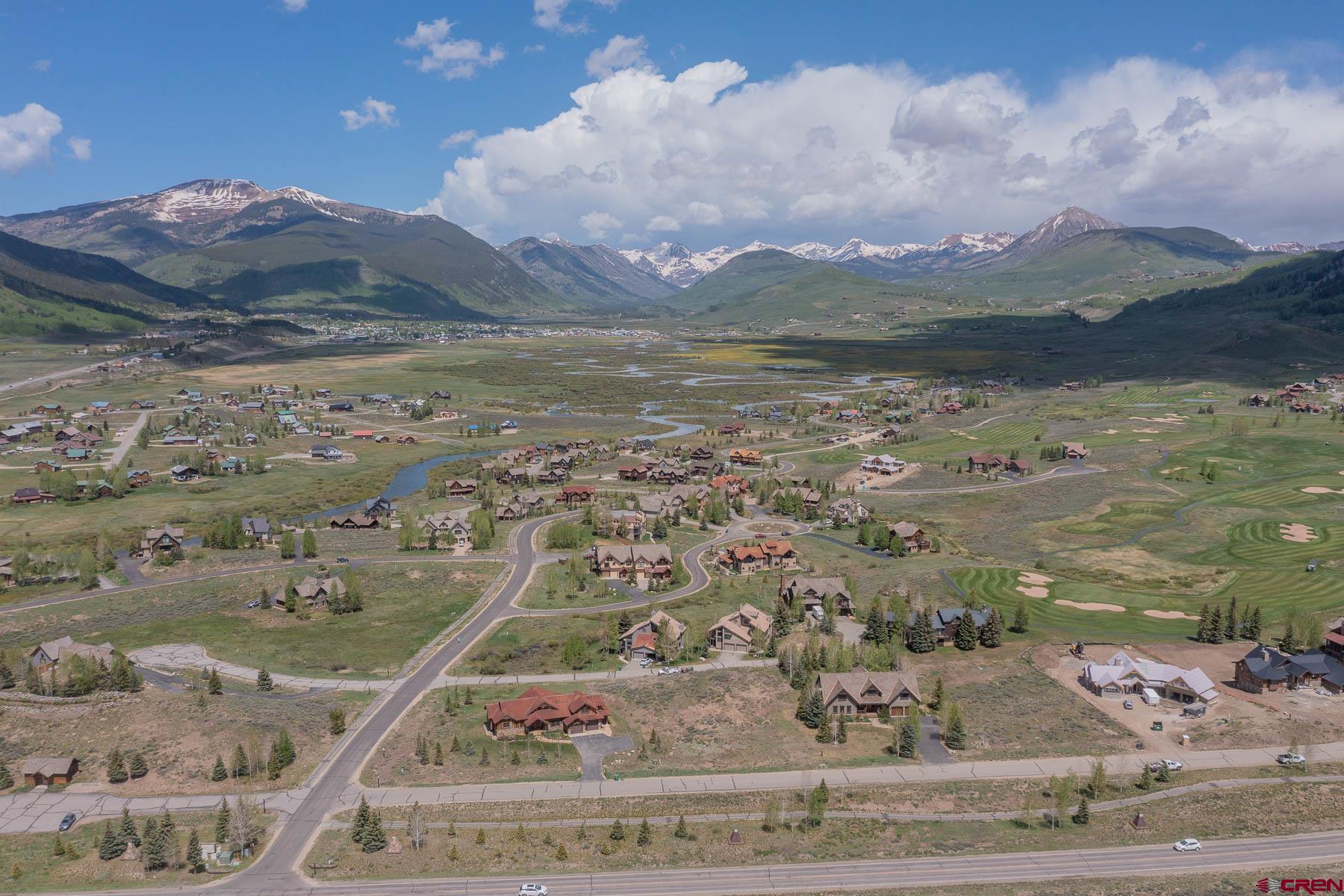 47 Fairway Lane Crested Butte, CO 81224 - Photo 26 of 32 a view of a lake with a mountain in the background