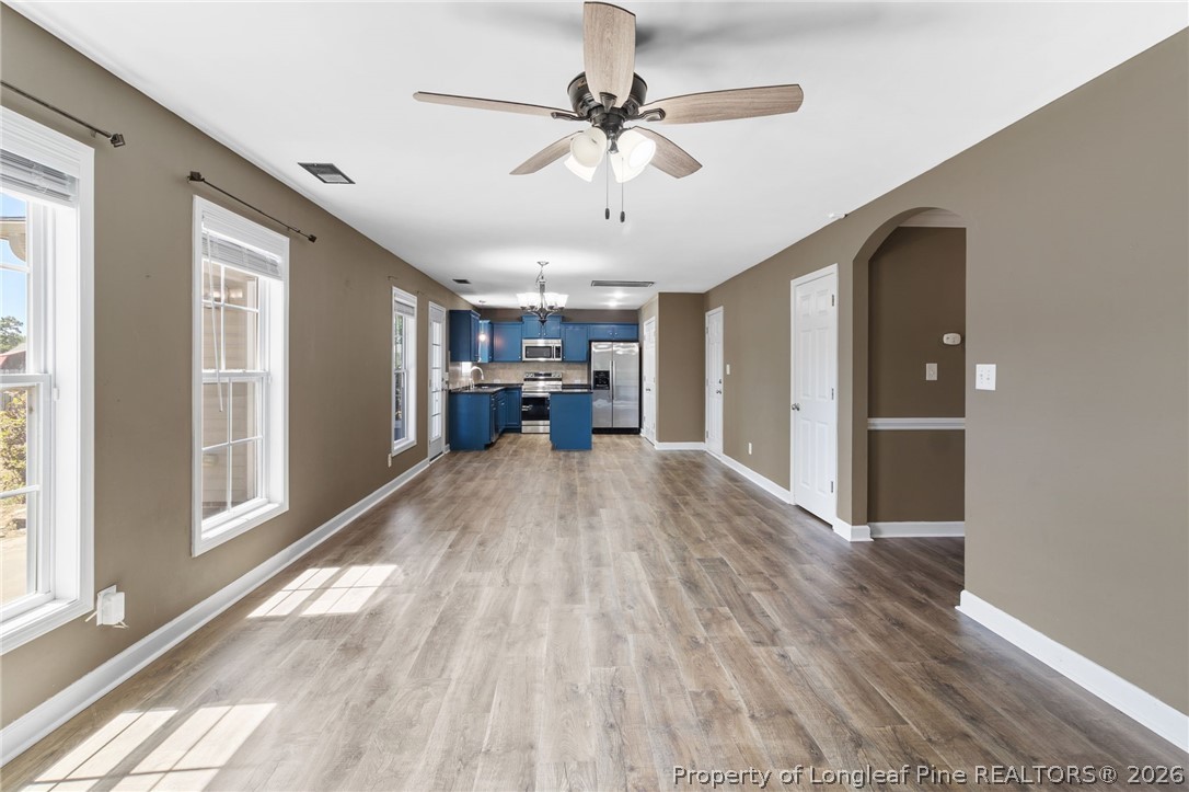 269 Declaration Drive Raeford, NC 28376 - Photo 12 of 44 a view of empty room with wooden floor and fan