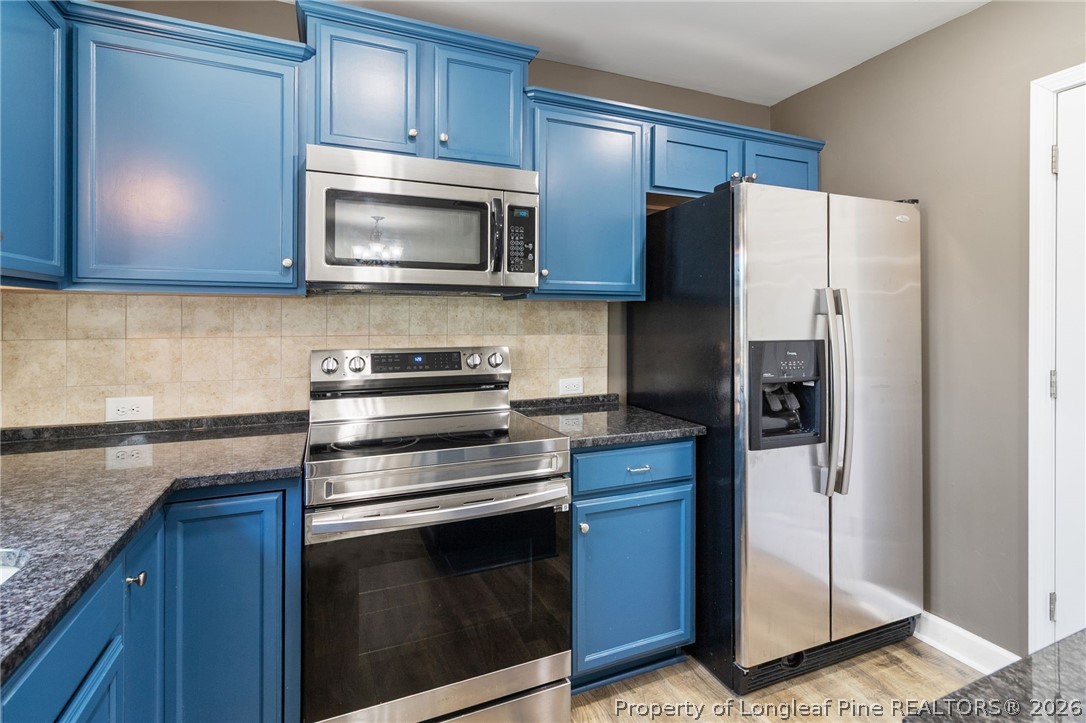 269 Declaration Drive Raeford, NC 28376 - Photo 16 of 44 a kitchen with a refrigerator stove and microwave