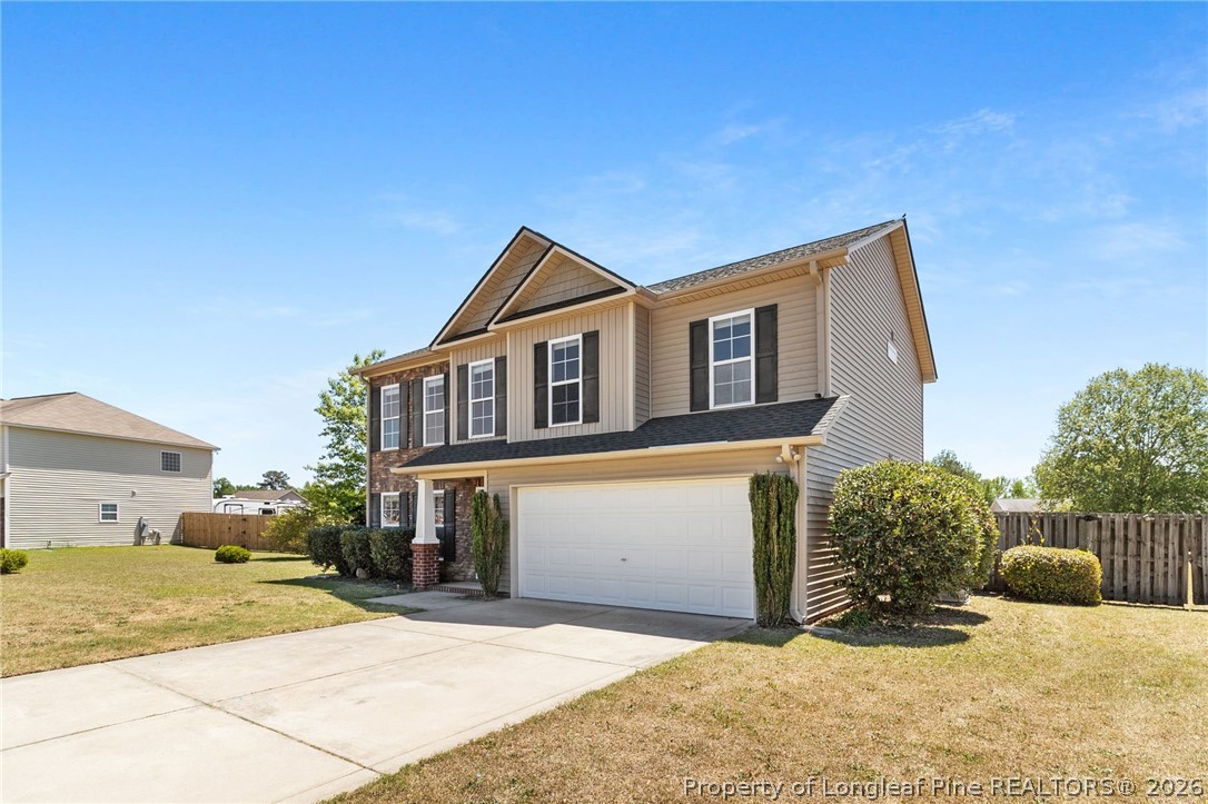 269 Declaration Drive Raeford, NC 28376 - Photo 2 of 44 a front view of a house with a yard
