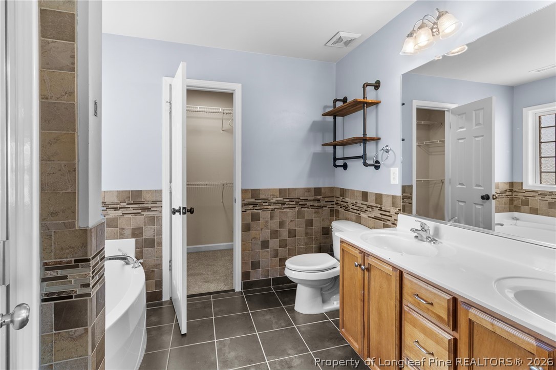 269 Declaration Drive Raeford, NC 28376 - Photo 23 of 44 a bathroom with a sink a toilet and shower