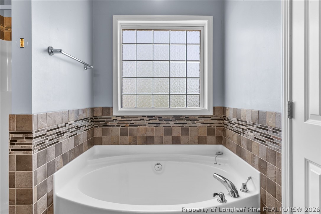 269 Declaration Drive Raeford, NC 28376 - Photo 25 of 44 a bathroom with a bathtub