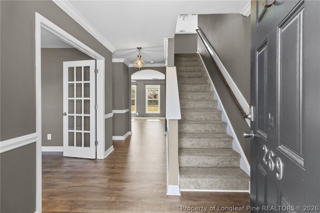 269 Declaration Drive Raeford, NC 28376 - Photo 5 of 44 a view of entryway and hall with wooden floor