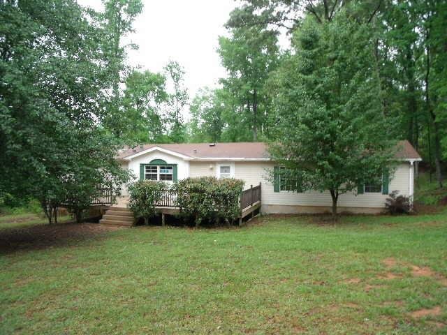 2955 Tribble Road Fort Valley, GA 31030 - Photo 1 of 1 a view of a house with a back yard