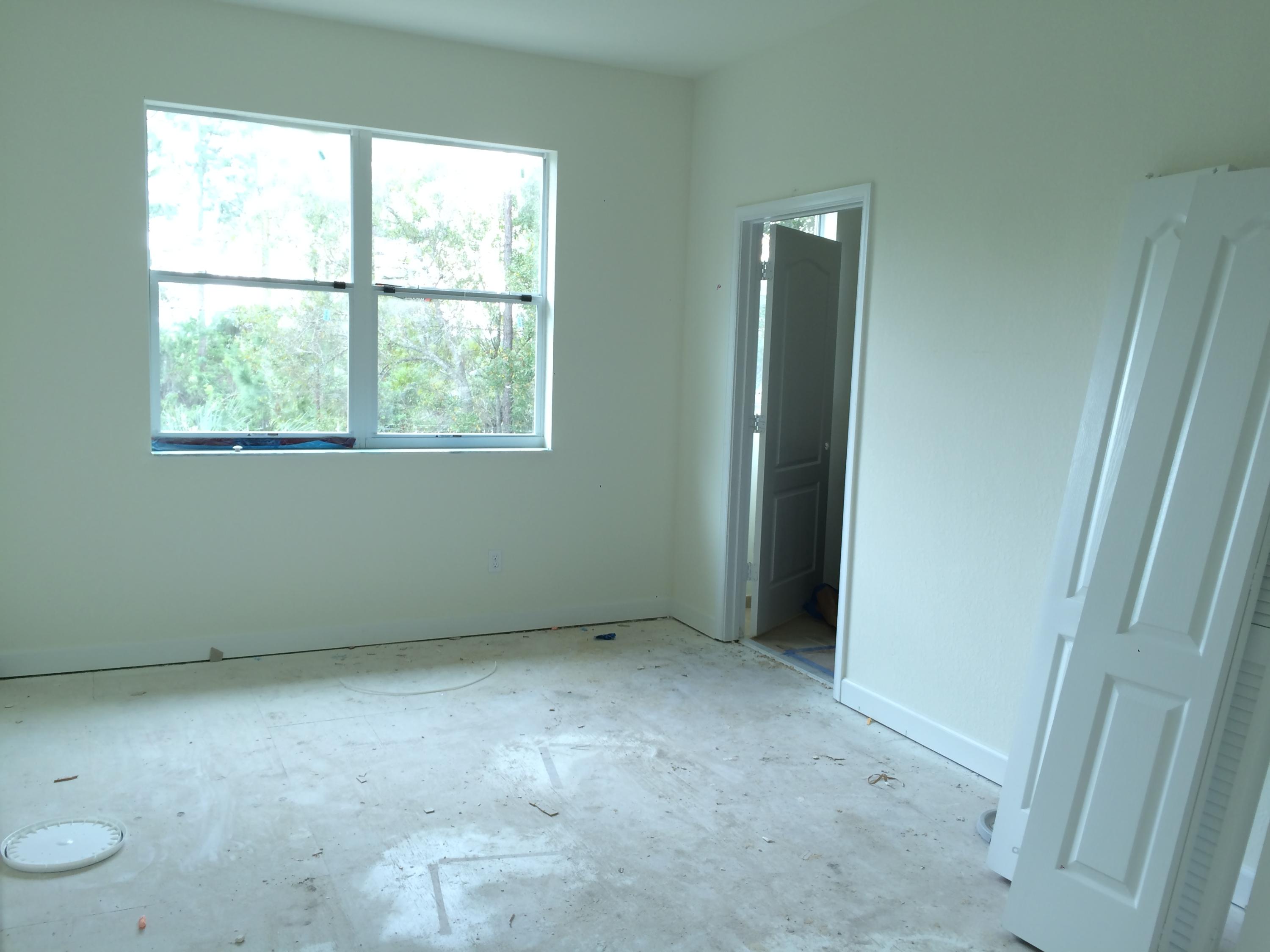 9614 Southwest Purple Martin Way Stuart, FL 34997 - Photo 5 of 8 Master Bedroom