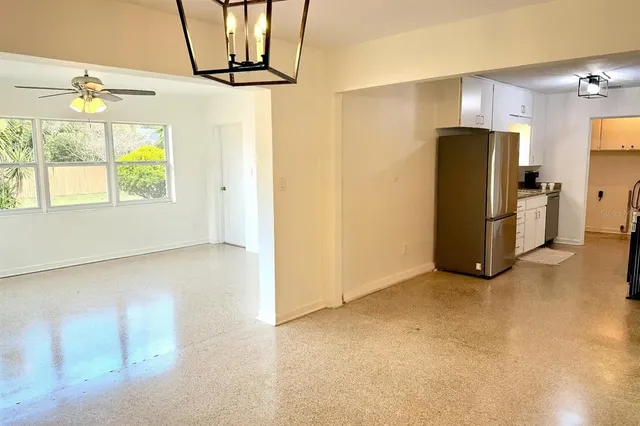 a view of a livingroom with a refrigerator