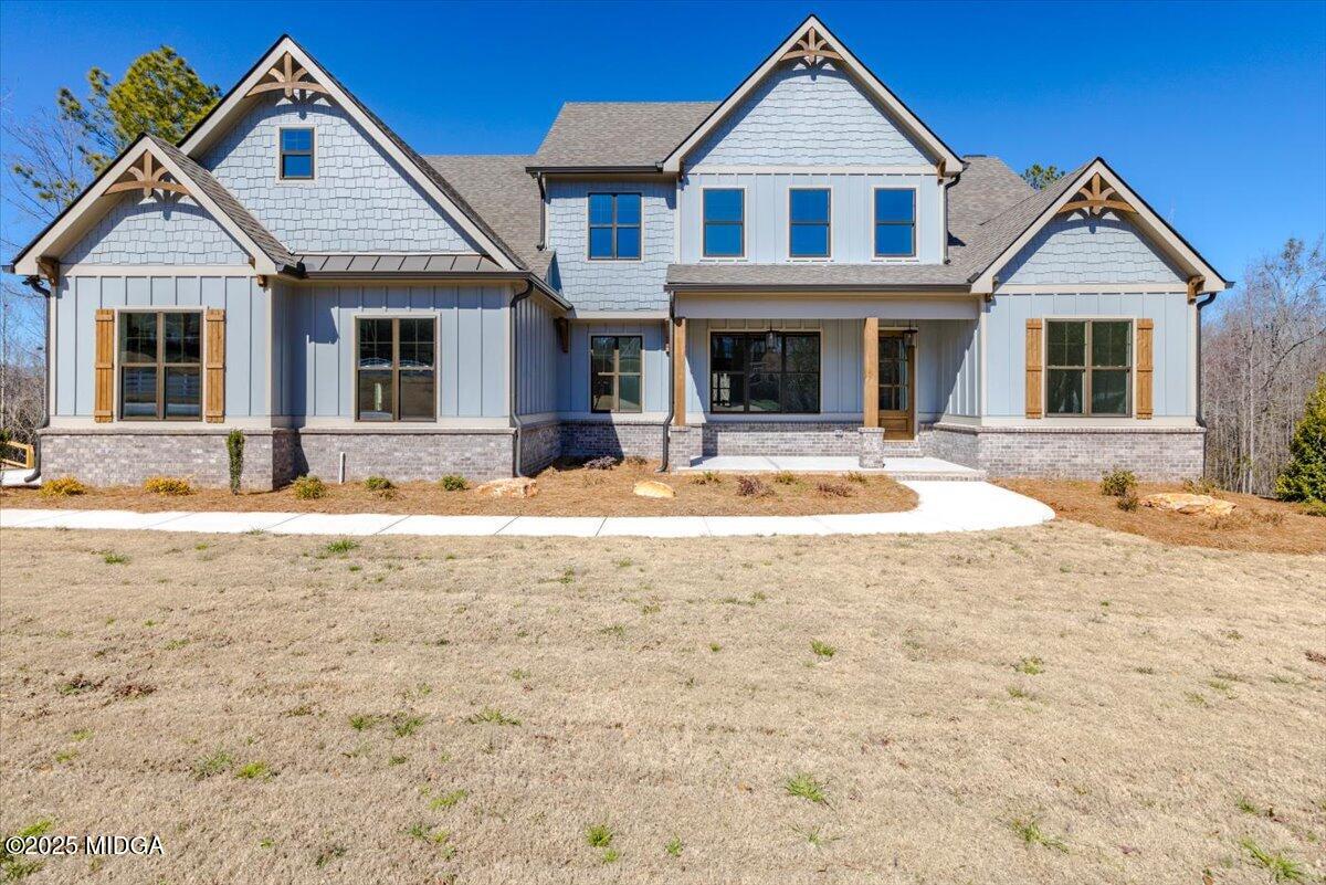 251 Preakness Way Forsyth, GA 31029 - Photo 1 of 26 a front view of a house with a yard