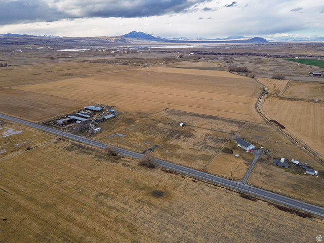 3285 West 600 South Logan, UT 84321 - Photo 11 of 16 Aerial view of property's location with rural landscape and a mountainous background