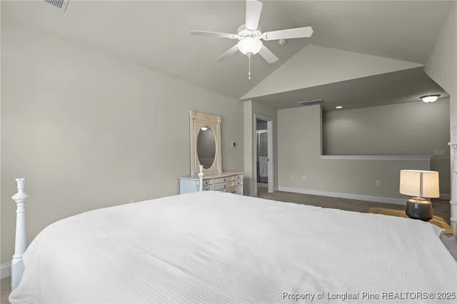 a large white bed in a white room