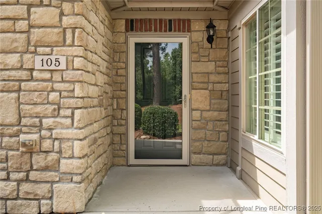 a view of a brick house with a large window