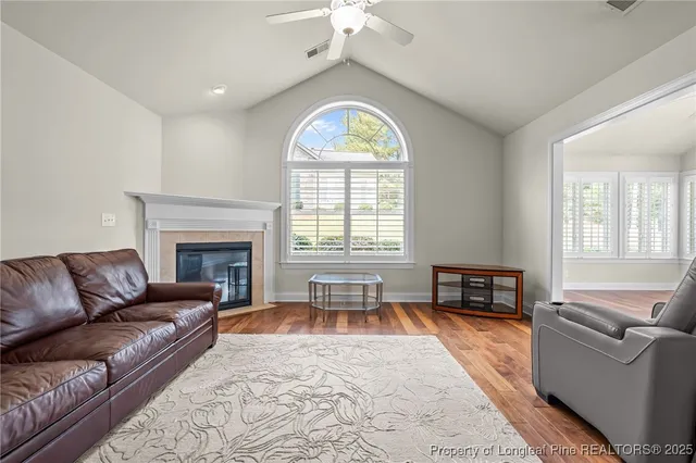 a living room with furniture and a fireplace