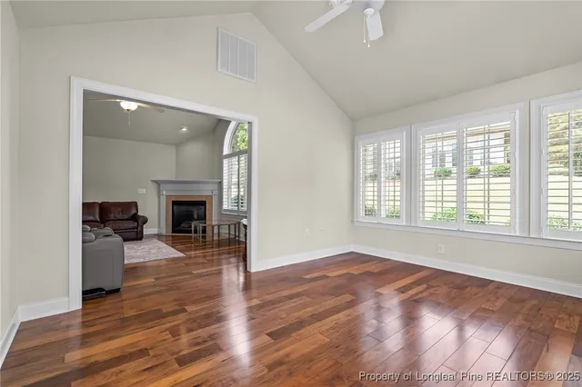 wooden floor fireplace and dining room in a livingroom