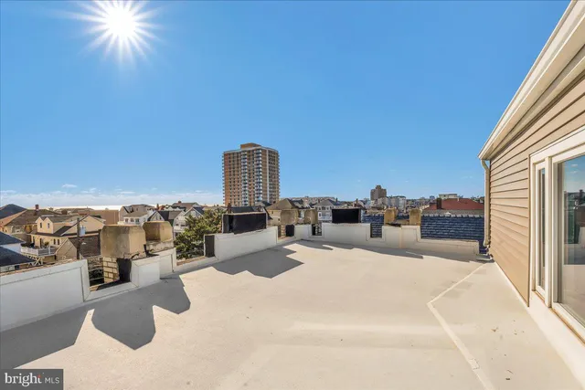 a view of roof deck with patio