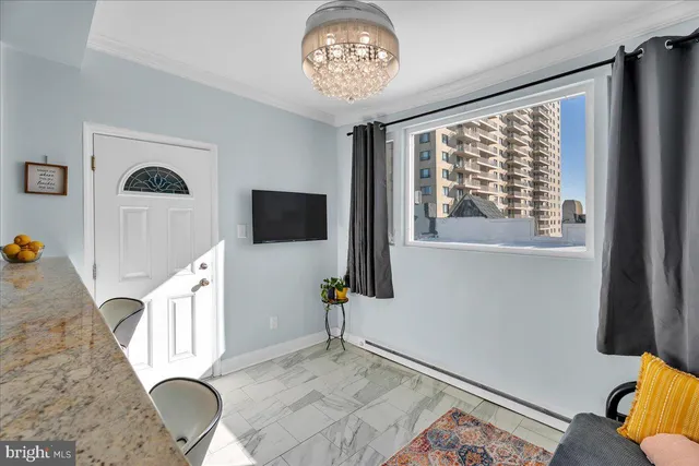 a view of a livingroom with furniture and windows