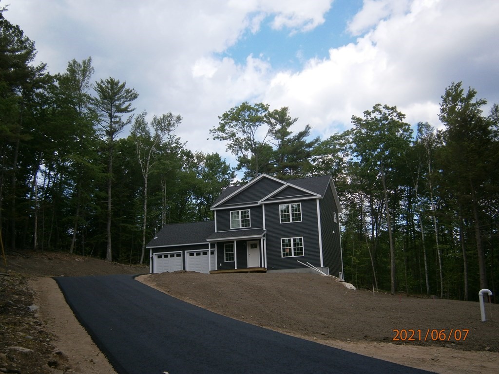 0 Nh Rt 119 Rindge, NH 03461 - Photo 1 of 11 a front view of a house with a garden