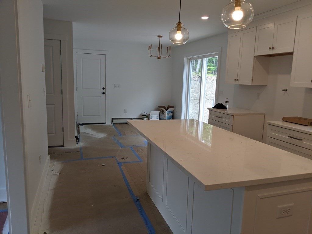 0 Nh Rt 119 Rindge, NH 03461 - Photo 3 of 11 a kitchen with a sink a stove and cabinets