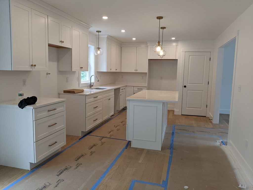 0 Nh Rt 119 Rindge, NH 03461 - Photo 4 of 11 a kitchen with white cabinets and sink