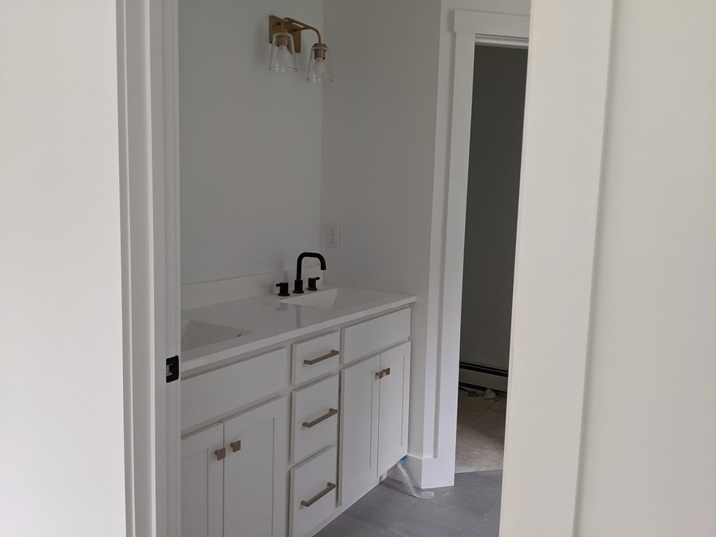 0 Nh Rt 119 Rindge, NH 03461 - Photo 8 of 11 a bathroom with a sink and mirror