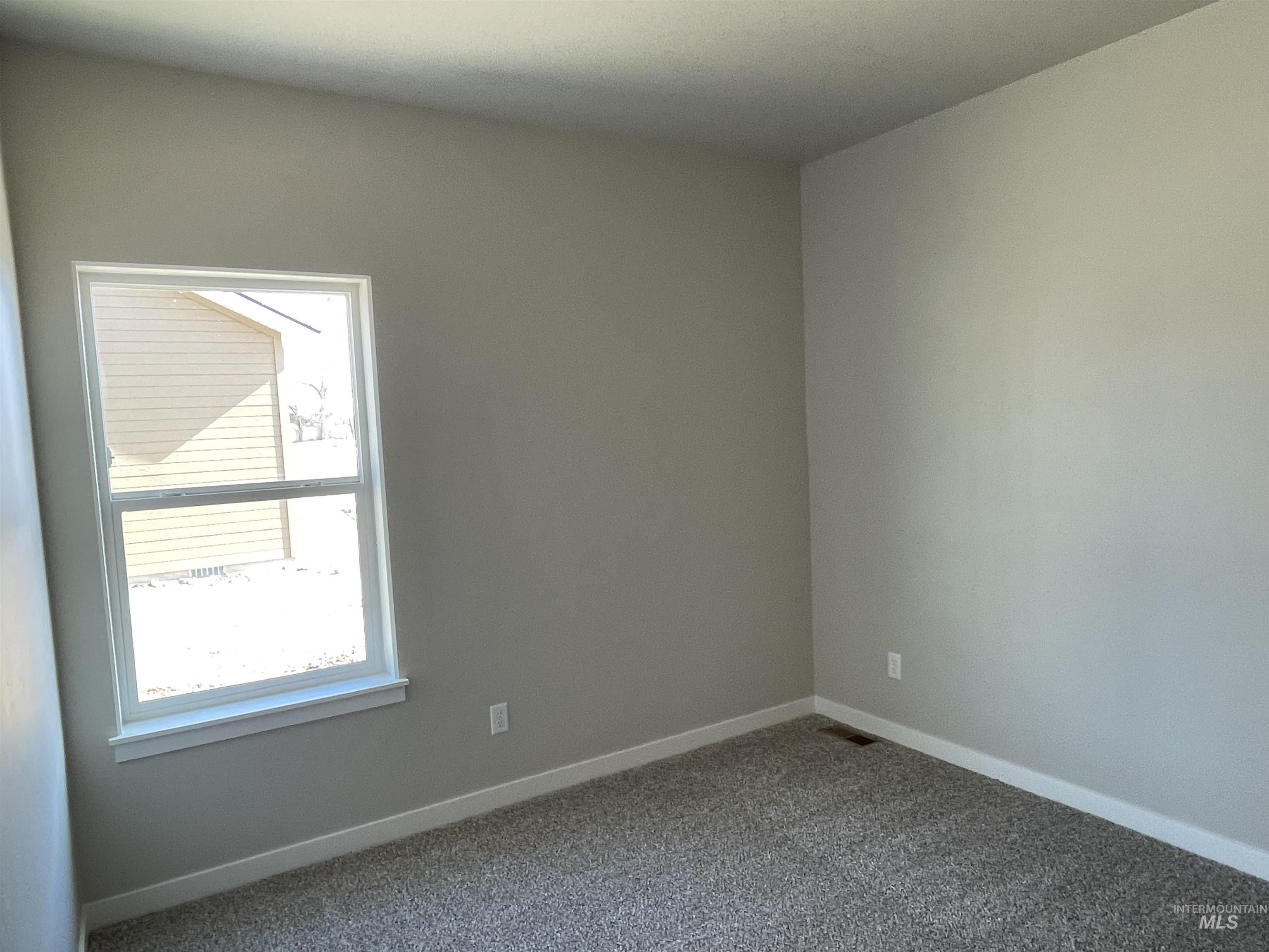 939 Quartz Road Kimberly, ID 83341 - Photo 14 of 18 Empty room featuring baseboards and carpet floors