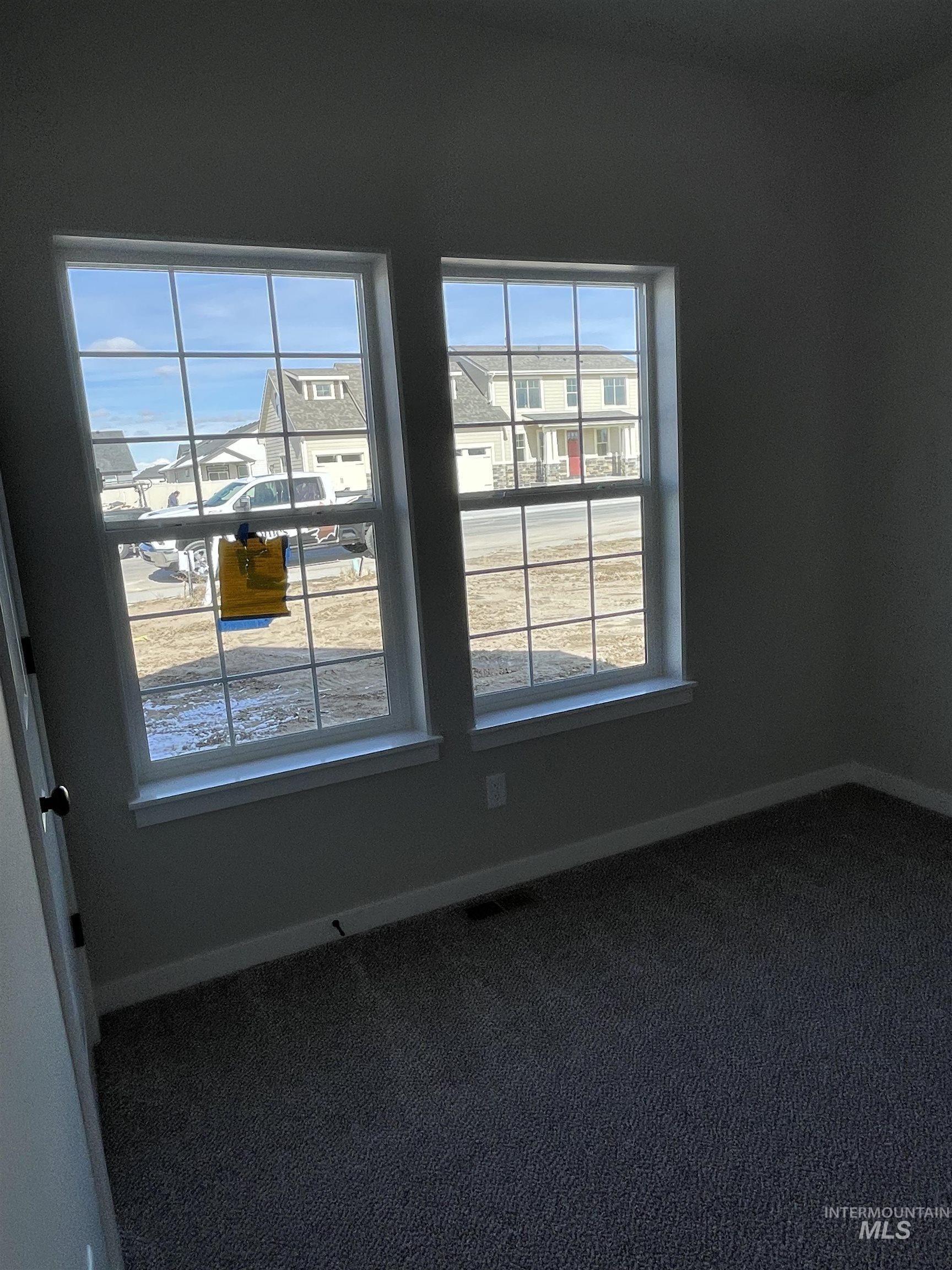 939 Quartz Road Kimberly, ID 83341 - Photo 17 of 18 Unfurnished room with dark colored carpet and baseboards