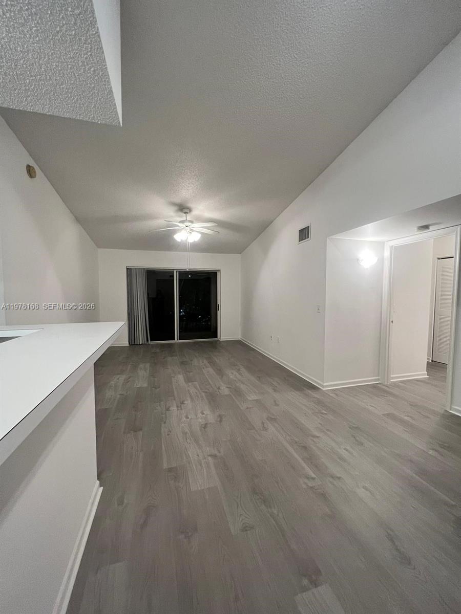 2173 Renaissance Boulevard, Unit 201 Miramar, FL 33025 - Photo 2 of 12 a view of an empty room with a window