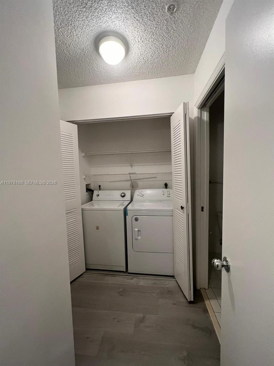 2173 Renaissance Boulevard, Unit 201 Miramar, FL 33025 - Photo 3 of 12 a utility room with dryer and washer