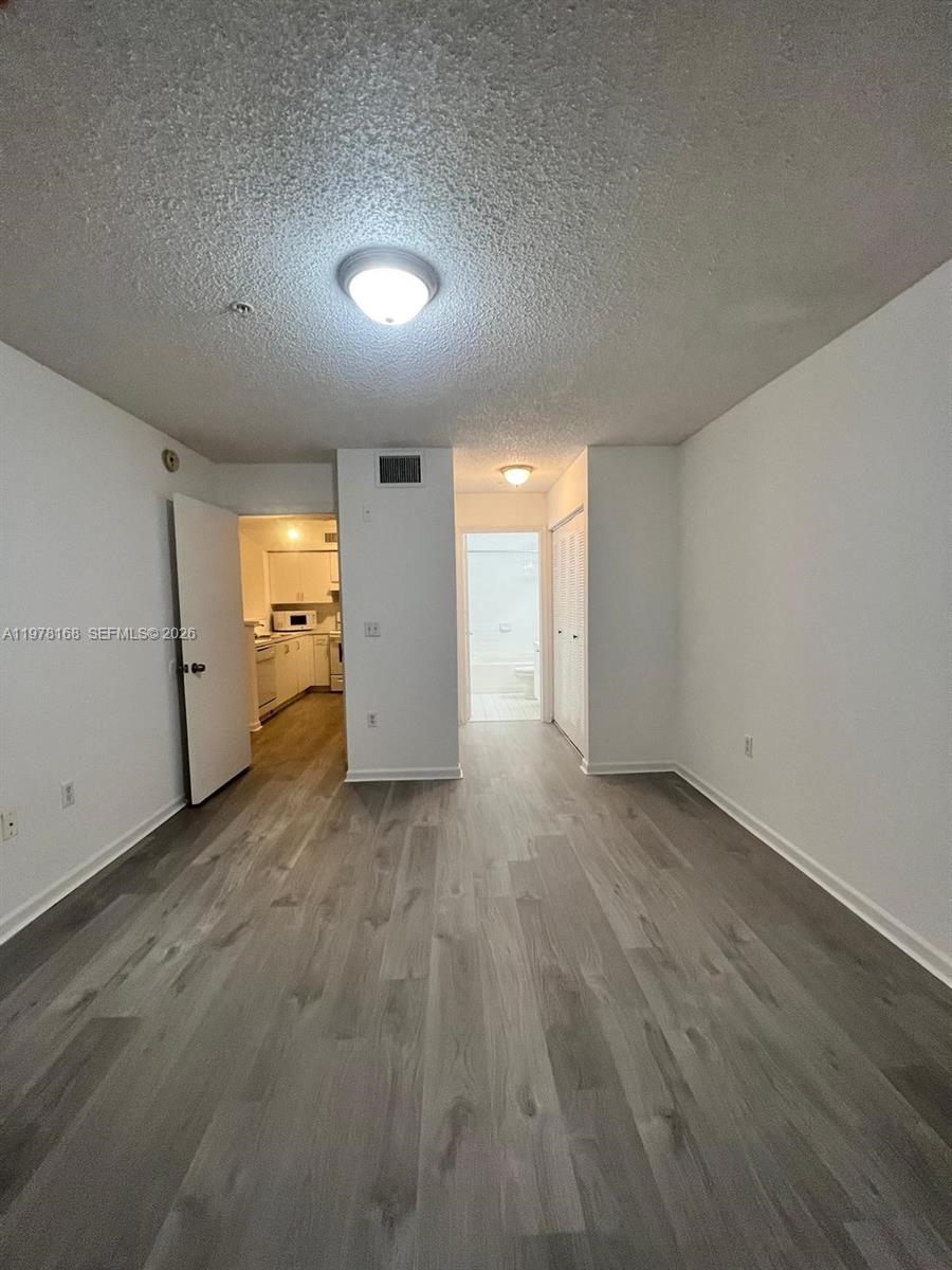 2173 Renaissance Boulevard, Unit 201 Miramar, FL 33025 - Photo 10 of 12 a view of a livingroom with wooden floor