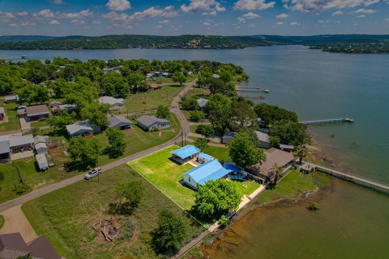 809 Lakeshore Loop Tow, TX 78672 - Photo 3 of 33 an aerial view of ocean with residential house with outdoor space