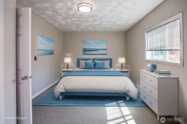 a bedroom with a bed and window