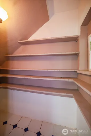 a front view of a house with a black and white checkered floor