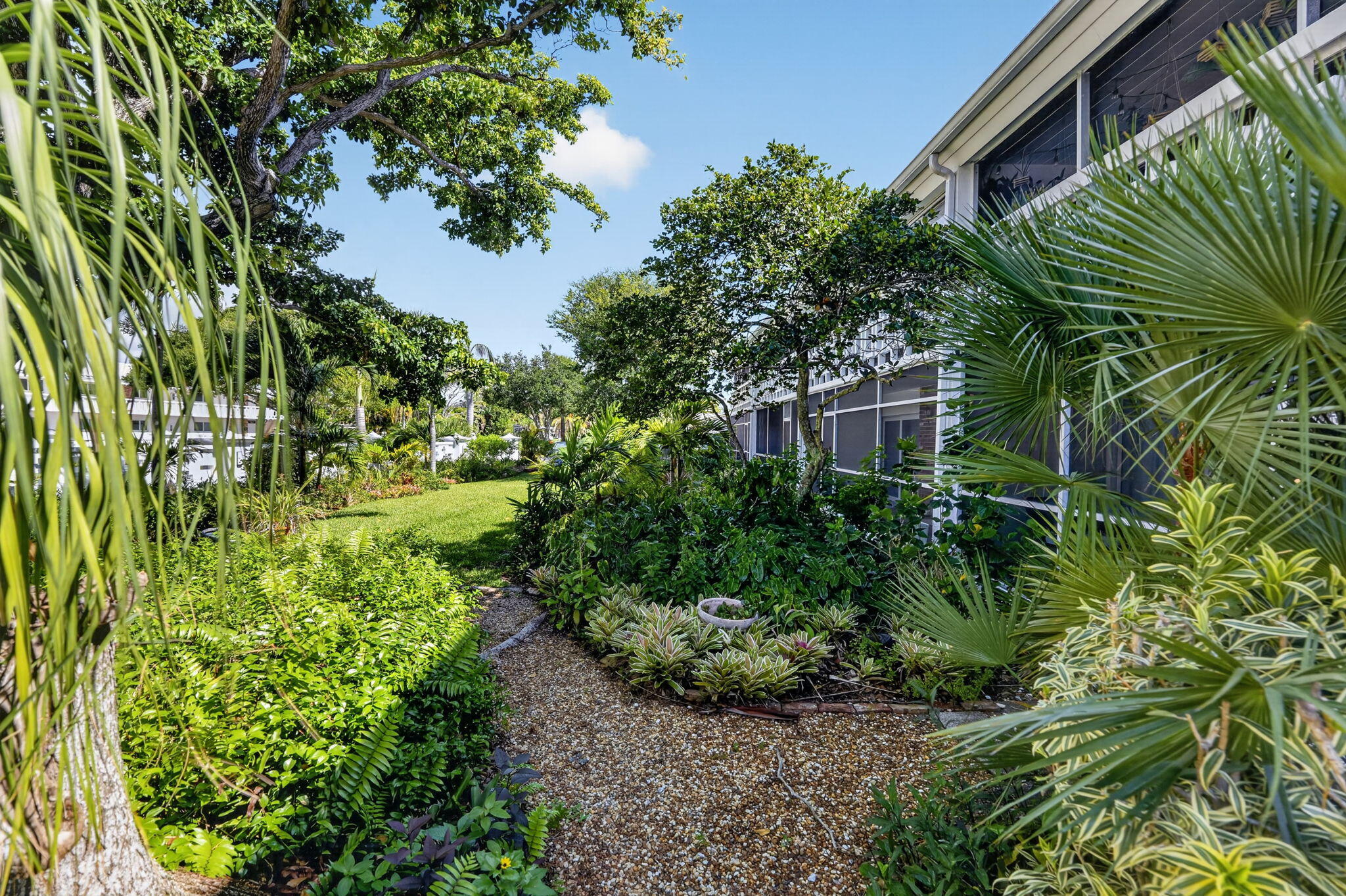 91 Willow Road, Unit 104 Tequesta, FL 33469 - Photo 19 of 25 Garden View from Screened Porch