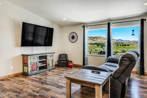 a workspace with furniture and a flat screen tv