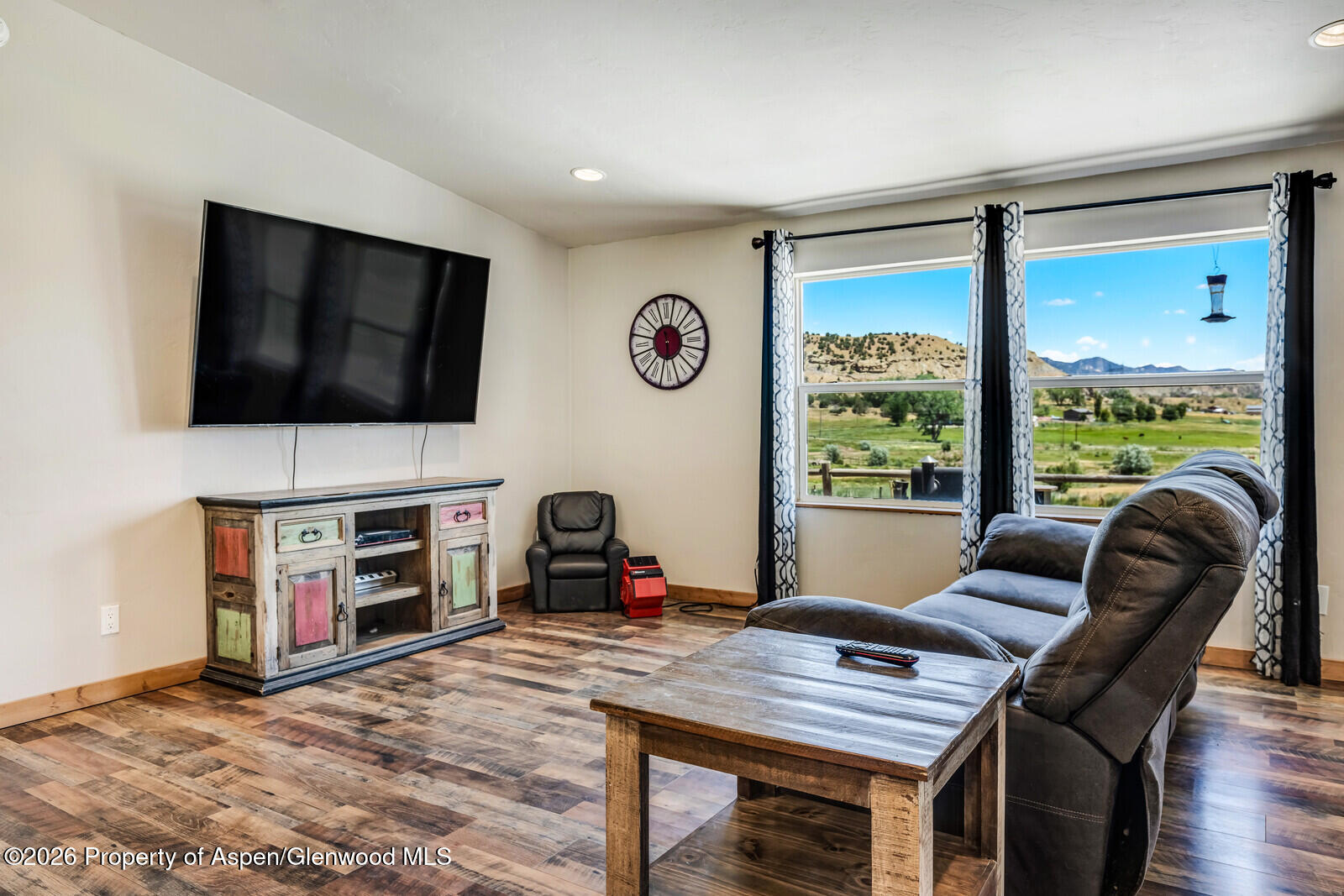 2880 County Road 233 Rifle, CO 81650 - Photo 11 of 47 a workspace with furniture and a flat screen tv