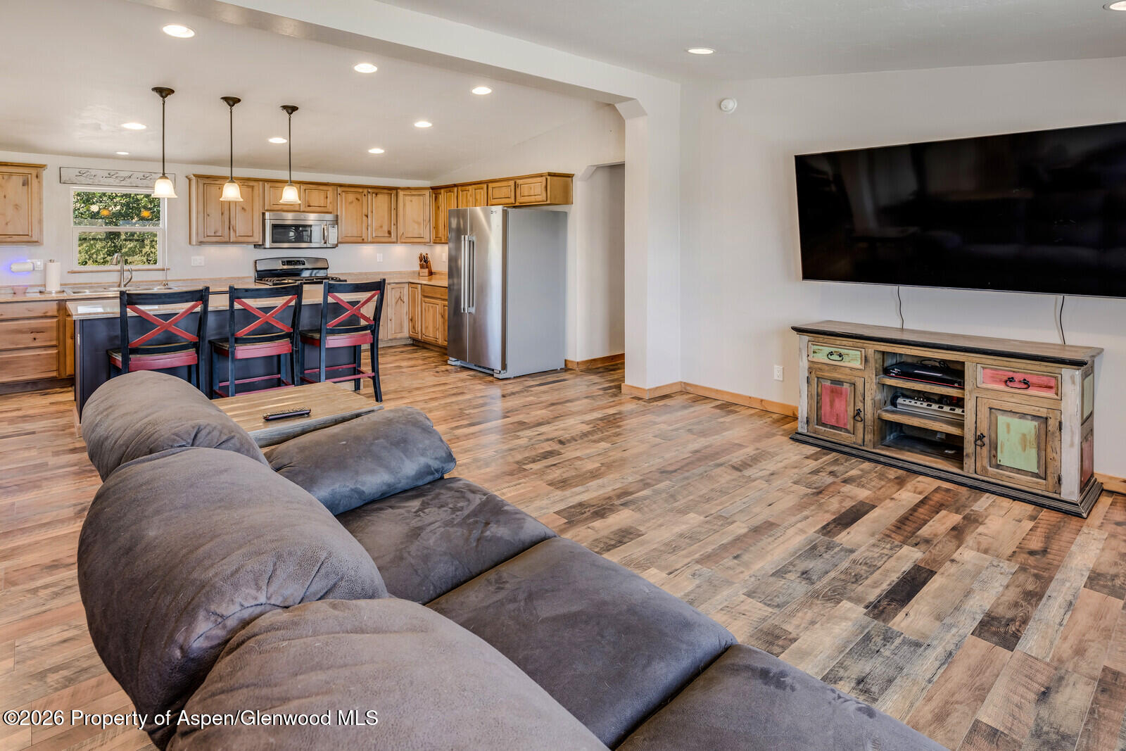 2880 County Road 233 Rifle, CO 81650 - Photo 12 of 47 a living room with furniture and a flat screen tv