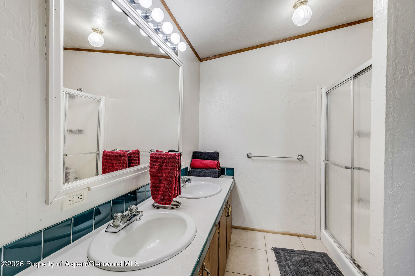2880 County Road 233 Rifle, CO 81650 - Photo 17 of 47 a bathroom with a sink and a mirror