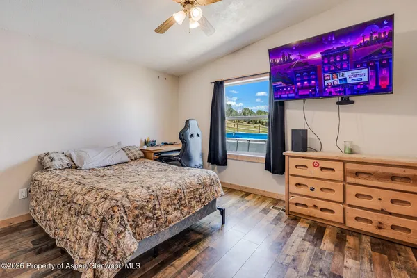 a bedroom with a bed and a dresser