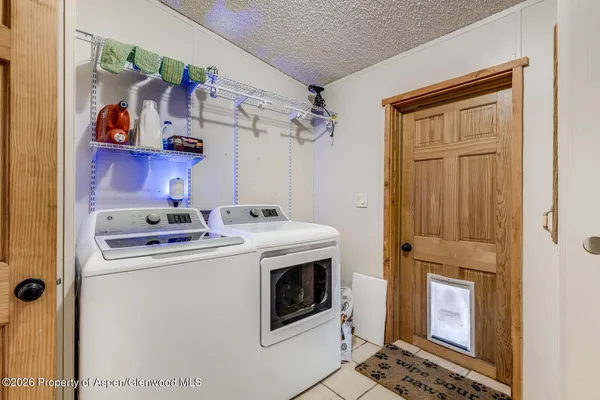 a kitchen with a stove and a refrigerator