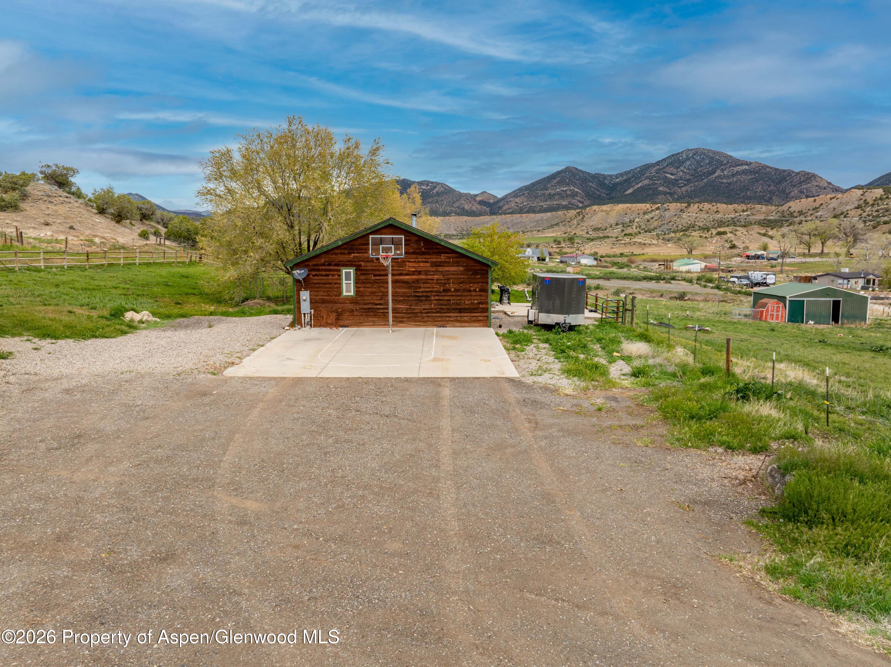 2880 County Road 233 Rifle, CO 81650 - Photo 26 of 47 a view of a house with a yard and balcony