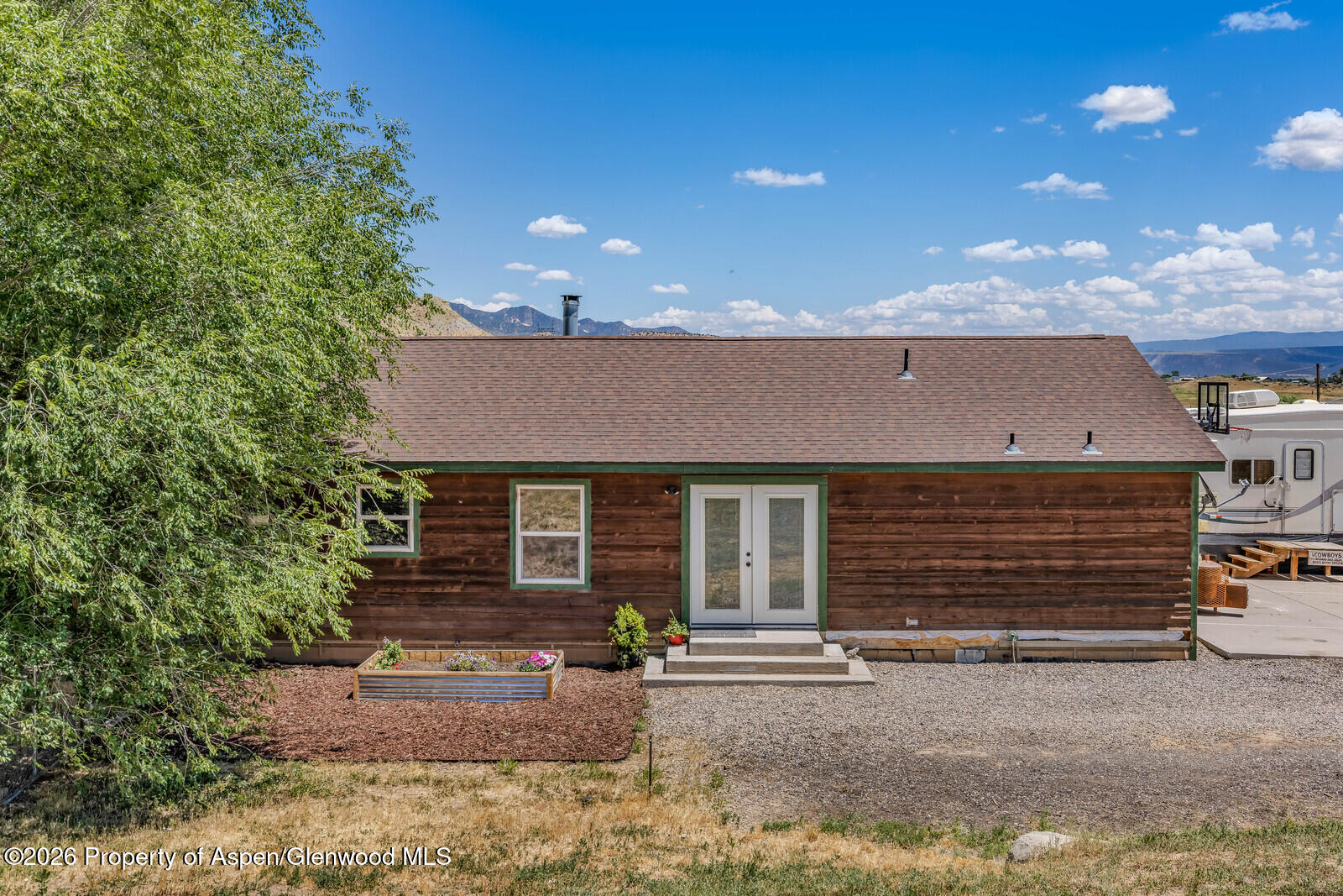 2880 County Road 233 Rifle, CO 81650 - Photo 27 of 47 a view of a house with a yard