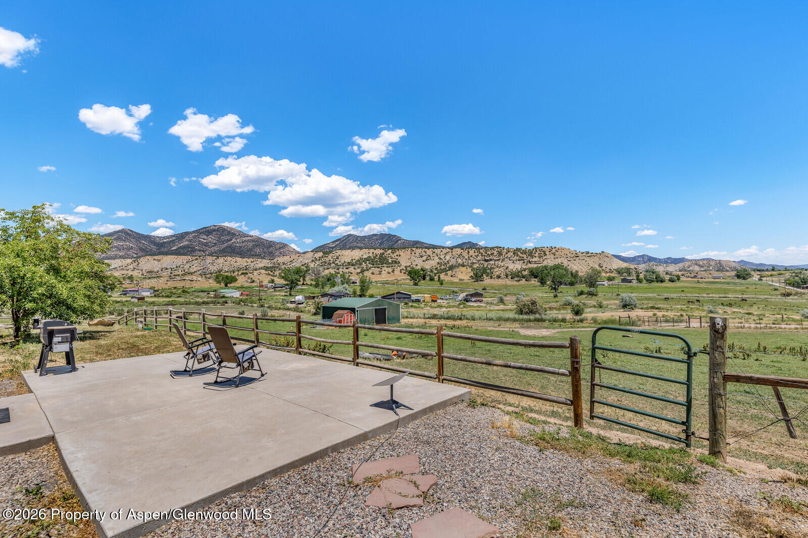 2880 County Road 233 Rifle, CO 81650 - Photo 30 of 47 a view of a terrace with a table and chairs