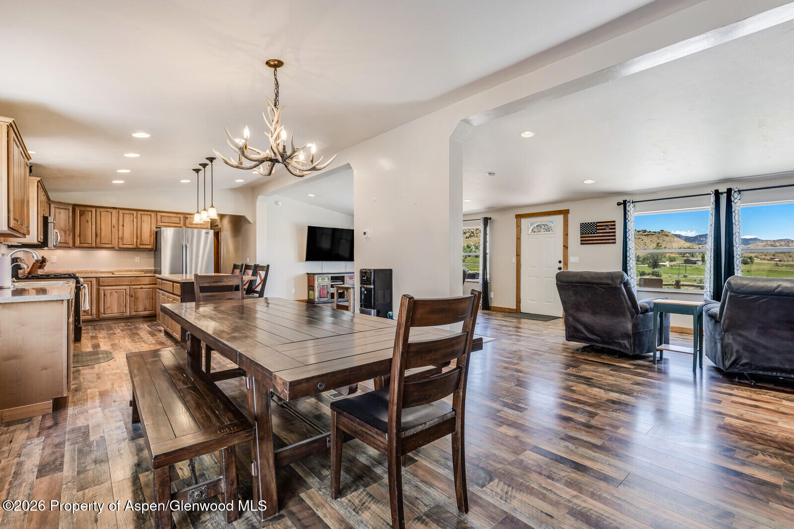 2880 County Road 233 Rifle, CO 81650 - Photo 4 of 47 a view of a dining room with furniture window and wooden floor
