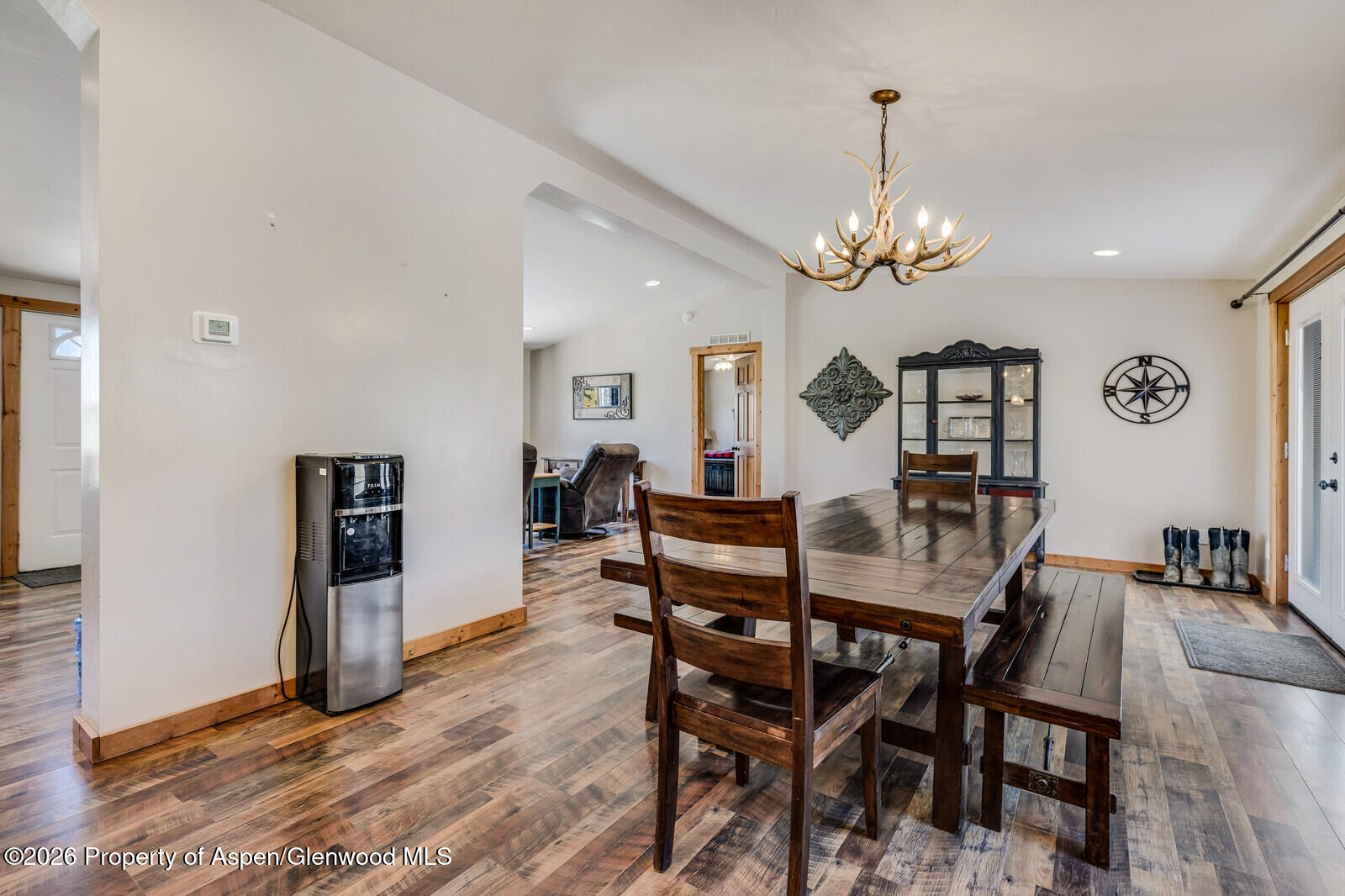2880 County Road 233 Rifle, CO 81650 - Photo 5 of 47 a view of a dining room with furniture and wooden floor
