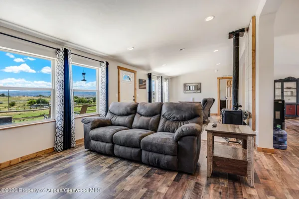 a living room with furniture and a large window