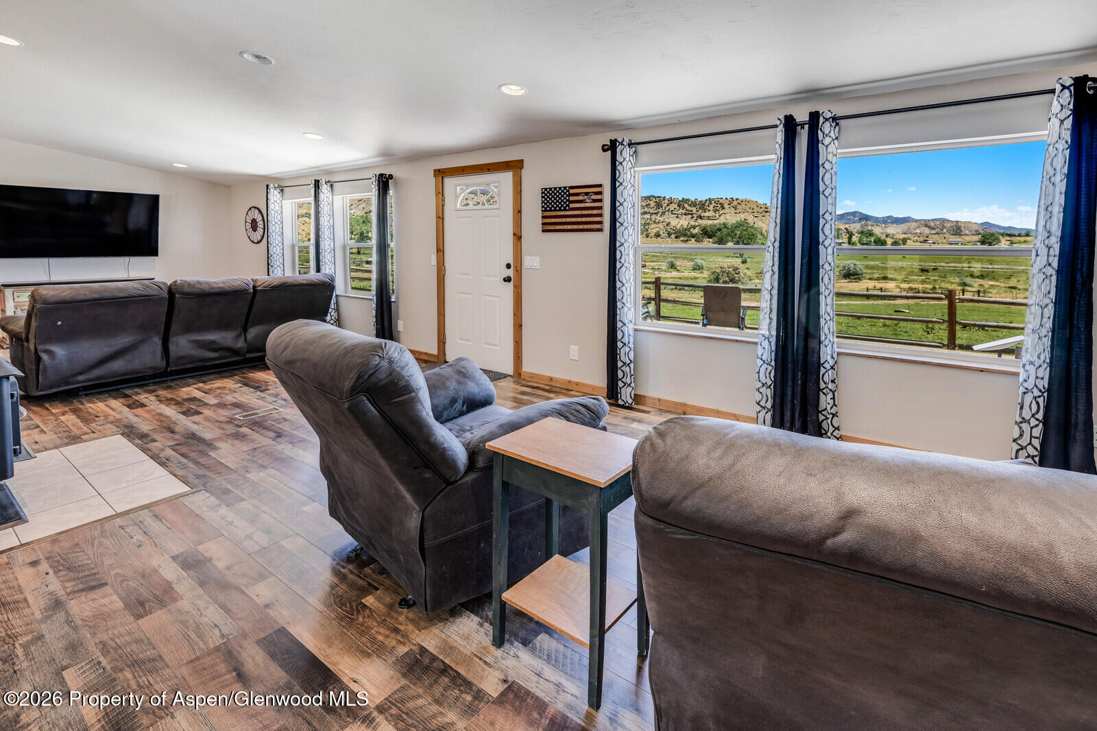 2880 County Road 233 Rifle, CO 81650 - Photo 10 of 47 a living room with furniture and a flat screen tv