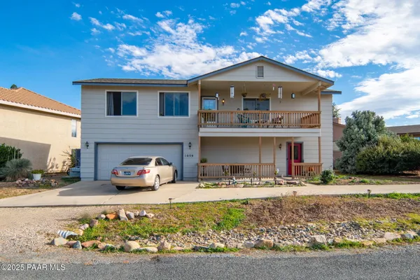 a front view of a house with parking