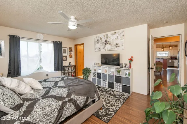 a bed room with a bed and a television