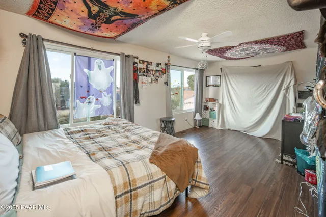 a view of a hardwood floor and wardrobe