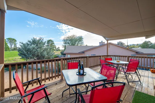 a view of a balcony with furniture