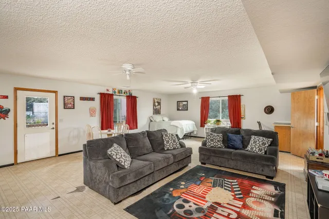 a view of a livingroom with furniture and a table