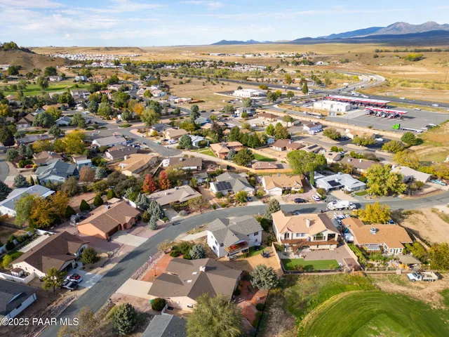 an aerial view of a house with a garden and a yard